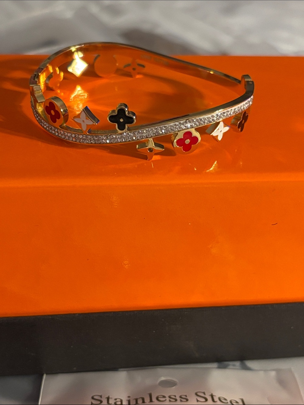 Fashion Jewelry Gold Bangle with Red & Black Flower Accents